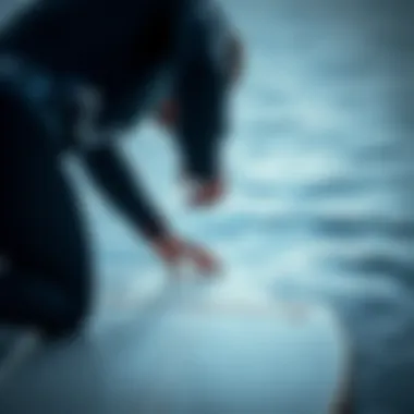 Wetsuit fitting on a surfboard in cold water