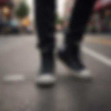 A stylish individual wearing black Converse high tops in a vibrant street scene