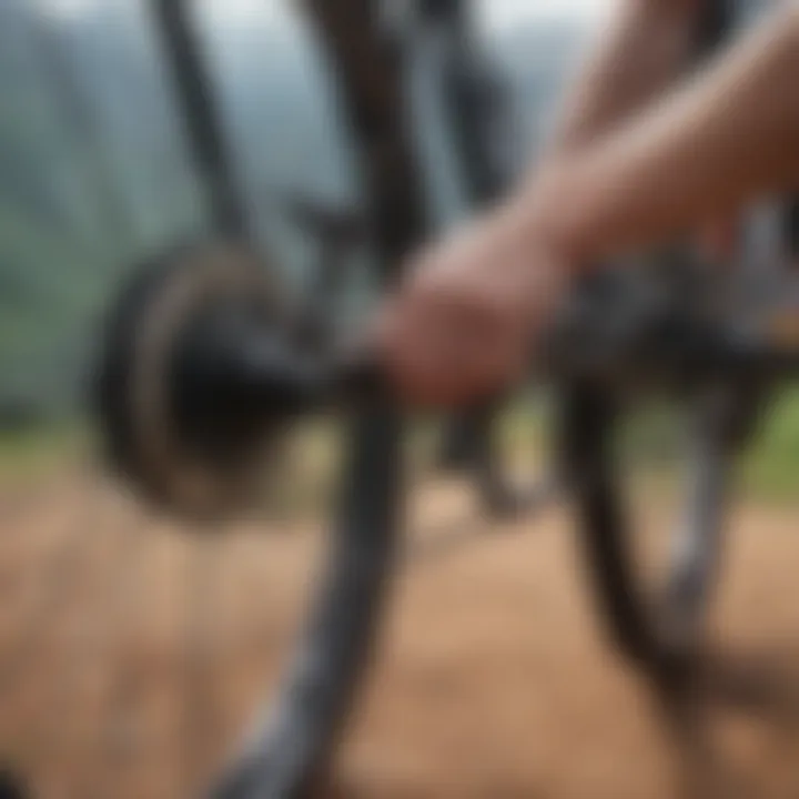 A mountain biker inspecting the chain of a bike, emphasizing maintenance practices.