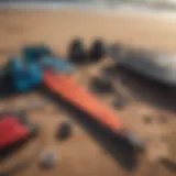 Kite surfing gear laid out on the beach, showcasing essential supplies.