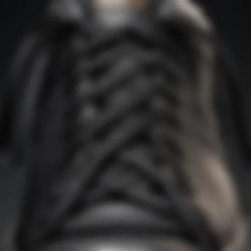 Close-up of black ribbon shoelaces intertwined on a sneaker