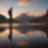 Sunset over a mountain peak with a silhouette of a skateboarder in the foreground