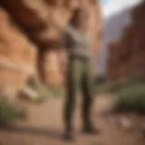 Olive cargo pants showcased in an outdoor extreme sports setting