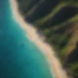 Aerial view of Oahu's pristine sandy beach with turquoise waters