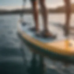 Innovative motorized fin technology displayed on a paddle board