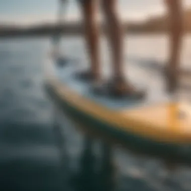 Innovative motorized fin technology displayed on a paddle board