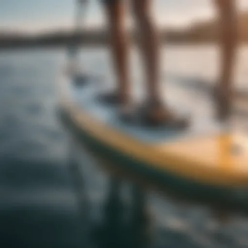 Innovative motorized fin technology displayed on a paddle board