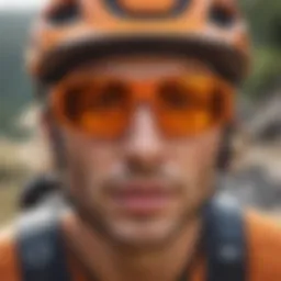 Athlete wearing orange round sunglasses during a thrilling mountain biking descent