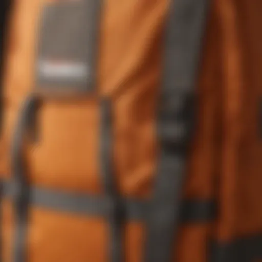 Close-up of the orange JanSport backpack showcasing its durable fabric and stitching