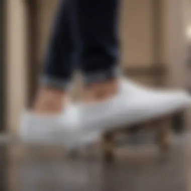 White Vans slip-on skate shoes on a skateboard