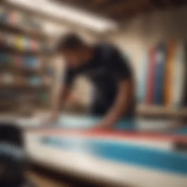 A surfer examining price tags on second hand surf boards in a shop