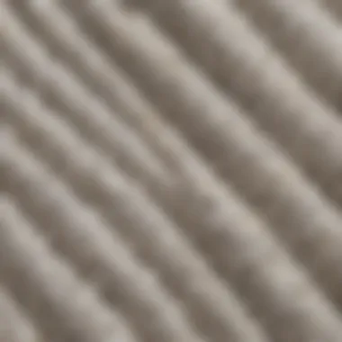 A close-up view of the fabric texture of the white True Religion sweater, showcasing its quality and craftsmanship.