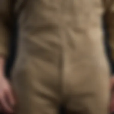 Close-up of khaki overalls demonstrating durable fabric and design features