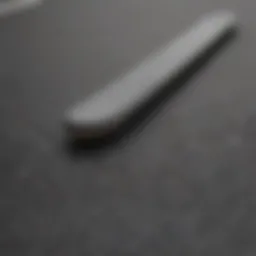 Close-up view of plain black grip tape applied on a skateboard deck, showcasing its texture.