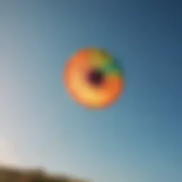 Vibrant power kite soaring against a clear blue sky