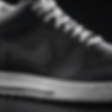 Close-up of black Nike shoes highlighting the texture and design of white soles