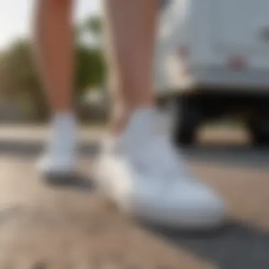 White leather Vans in an outdoor sports setting