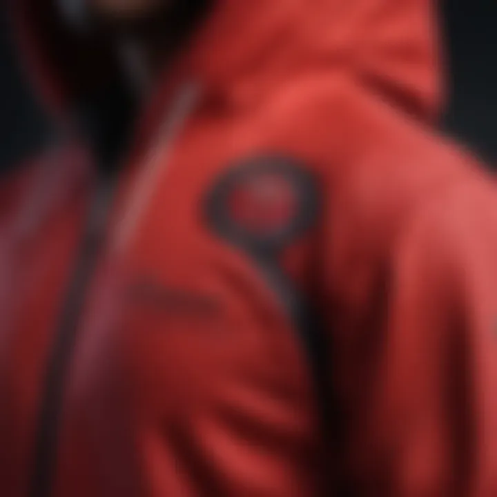 A close-up view of the fabric and stitching details of the red Champion hoodie