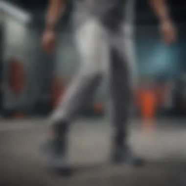 Dynamic athlete showcasing grey sweatpants with elastic ankles during an extreme sport activity